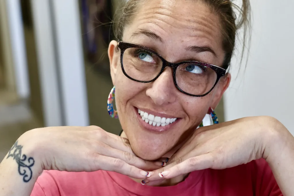 woman with dental implants smiling